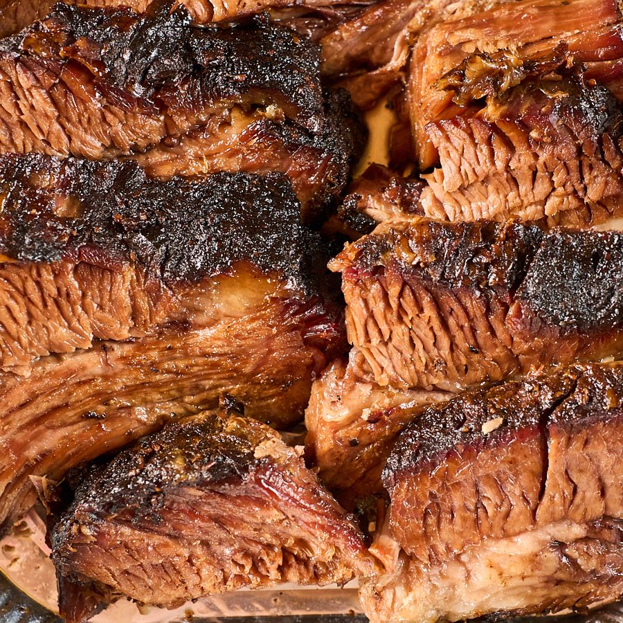 Close-up of sliced smoked brisket with bark